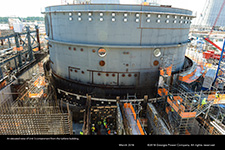 An elevated view of Unit 3 containment from the turbine building.