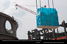 The KBO4 module, the first mechanical module to be installed in Unit 4â€™s nuclear island, is lifted into place.