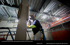 A construction team member welds equipment inside the Unit 3 nuclear island.