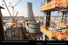 Vogtle Unit 4 containment vessel (background) and turbine building (right).